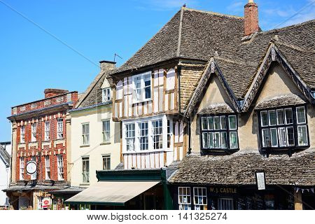 BURFORD, UNITED KINGDOM - JULY 20, 2016 - Interesting architecture detail above shops along The Hill shopping street Burford Oxfordshire England UK Western Europe, July 20, 2016.