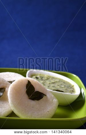 Idli With Coconut Chutney On Blue Background, Indian Dish : South Indian Favourite Food Rava Idli Or