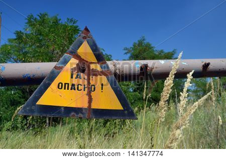Gas -danger sign (RU). Ukrainian gas pump station entrance.August 5, 2016.Near Kiev,Ukraine