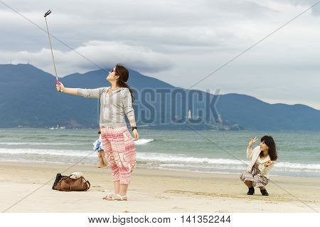 Young Woman Making Selfie In China Beach Danang