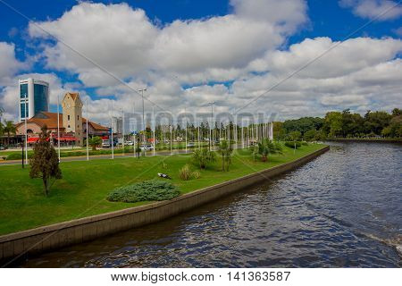 TIGRE, ARGENTINA - MAY 02, 2016: Nice view of the river with the city in the background on a cloudy day.