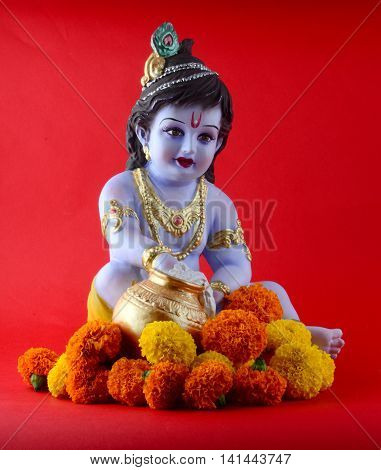 Hindu God Krishna on red background. Greeting Design