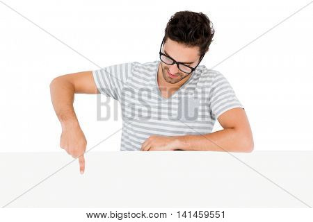 Handsome man pointing at fis finger to the white board