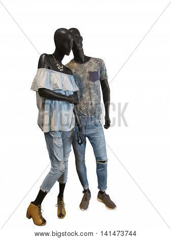 Two mannequins male and female dressed in casual summer clothes. Isolated on white background. No brand names or copyright objects.