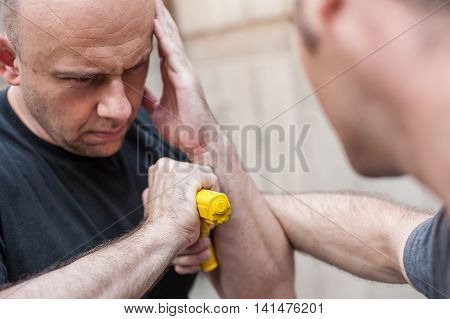 Gun Disarm. Self Defense Techniques Against A Gun Point.