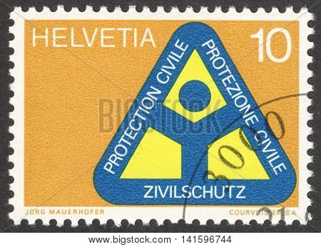 MOSCOW RUSSIA - CIRCA APRIL 2016: a post stamp printed in SWITZERLAND dedicated to the Civil Protection Organisation circa 1972