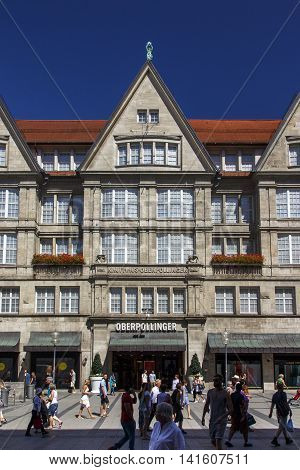 MUNICH, GERMANY - AUGUST 29, 2015: The Oberpollinger is a famous shopping mall in the inner city of Munich many luxary brands have retail stores inside unidentified people are passing by