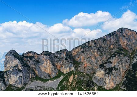 Mountain range high mountains peaks bright blue sky with clouds. Alps Austria