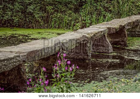 Stone bridge in pond at Nostell Priory England