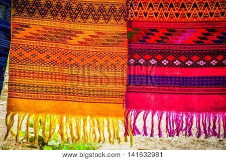 Colorful Mexican blankets hanging on a clothes line