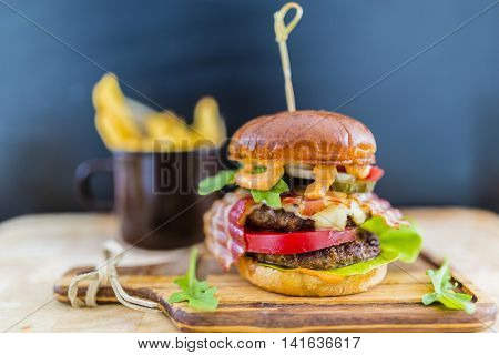Tasty street food grilled double beef burger in crispy shortbread with lettuce and mayonnaise