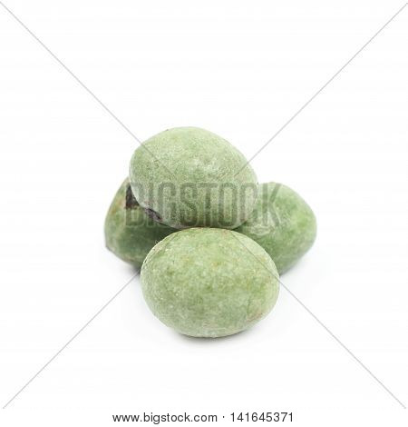 Green wasabi coated peanuts isolated over the white background