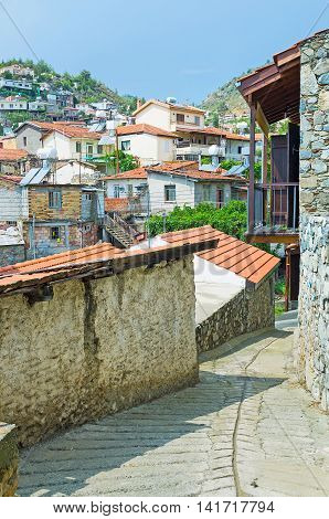 The narrow winding street of the hilly Pelendri village located in Troodos District Cyprus.