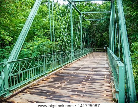 The Hibernia Mine Railroad Bridge dates back to 1879 but was reassembled as a foot bridge for the Raritan Greenway Park in 2007.