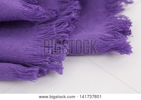 colorful scarfs  hanging on a white background
