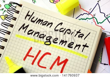 Sign human capital management HCM on a page of notebook.