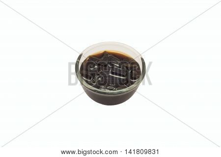 black glass jelly in a bowl on white background