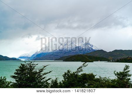 View of Gray Lake and Gray Glacier with the snow mountain in rainyday Patagonia Chile