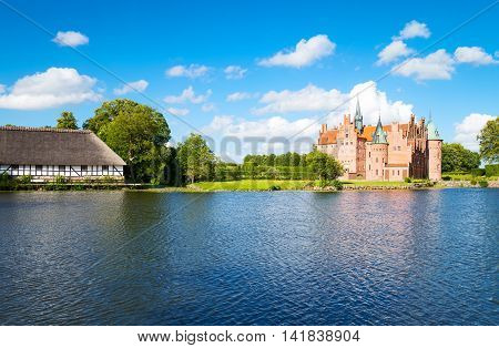 Kvaerndrup Denmark - July 21 2015: Panoramic view of the Egeskov castle on the lake