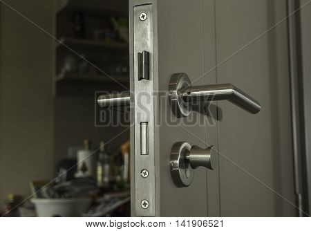 close-up the door face lock and silver handle in the room - can use to display or montage on product