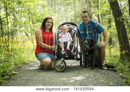A Family with Cute Baby girl Nature in the Forest