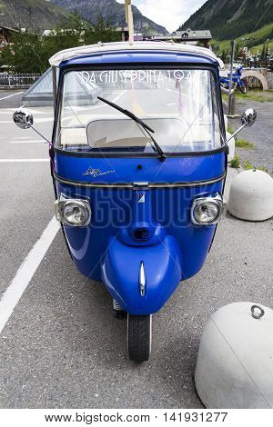 Livigno, Italy - August 1: Limited Edition Model Of Three-wheeled Vehicle Piaggio Ape Calessino Stan