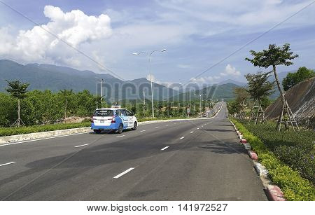 Da Nang, Vietnam - Jun 20, 2016: A taxi carrying tourist from city center to Ba Na Hills mountain resort. The resort is held and managed by one of the biggest Vietnamese corporation, Sun Group.