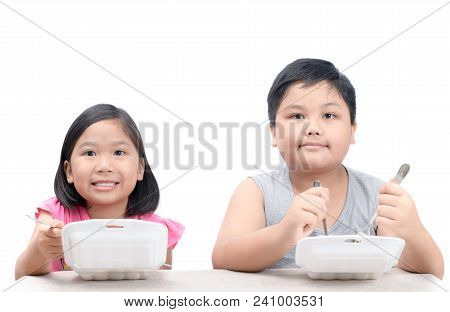 Brother And Sister Eating Fried Rice In Foam Box Isolated On White Background, Junk Food And Dangero