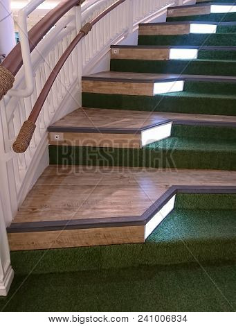 Wooden Staircase Decorated With Green Grass Artificia In Shopping Mall