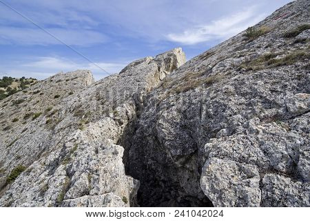 Deep Crack In The Rock. The Top Of Cape Alchak. Crimea, Beginning Of April.