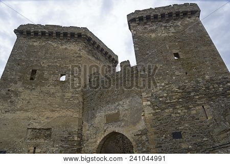Genoese Fortress In Sudak, Crimea. Gate Towers. Cloudy Day In Early April