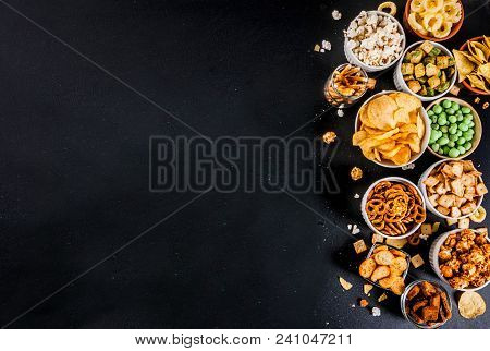 Variation Different Unhealthy Snacks Crackers, Sweet Salted Popcorn, Tortillas, Nuts, Straws, Bretse