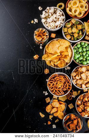 Variation Different Unhealthy Snacks Crackers, Sweet Salted Popcorn, Tortillas, Nuts, Straws, Bretse