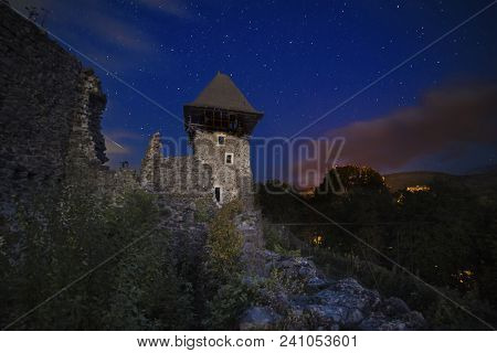 Ruins Of Nevitsky Castle Near Uzhgorod, Ukraine With A Lot Of Shiny Stars On The Dark Blue Sky