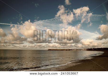 Beautiful Sealandscape With Dramatic Clouds Over Blue Sky And Soft Waves. Beauty World Natural Outdo