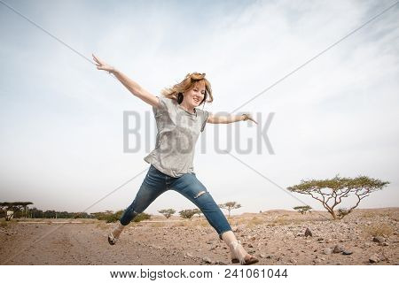 Girl Have Fun In Desert In A Summer Day