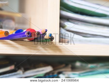 Multicolored Pencils In An Messy Wall Cabinet