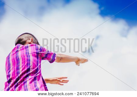 Student Acting Like A Superhero On Top Of Stepladder In School.