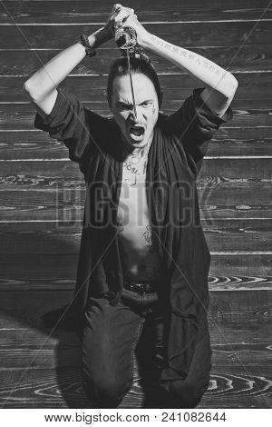 Man With Sword And Open Belly Preparing For Harakiri. Reincarnation And Rebirth. Suicide Ritual Conc