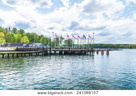 Olsztyn, Poland - May 1, 2018: Pier With Polish And Eu Flags On The City Beach On Ukiel Lake.