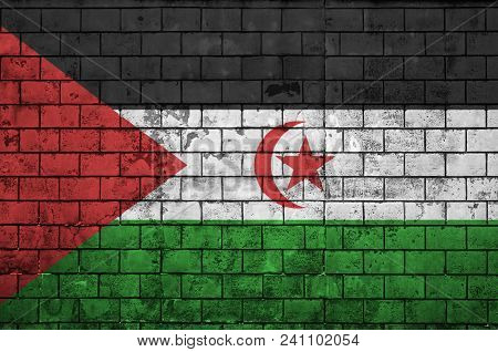 Western Sahara Flag Is Painted Onto An Old Brick Wall