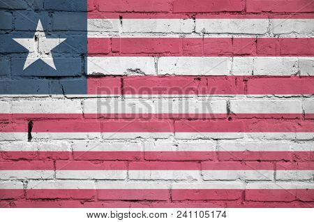Liberia Flag Is Painted Onto An Old Brick Wall