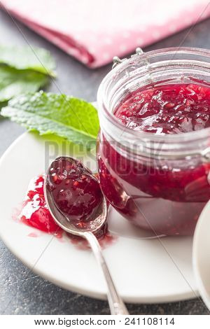Raspberry jam jelly in jar.