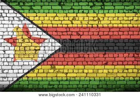 Zimbabwe Flag Is Painted Onto An Old Brick Wall
