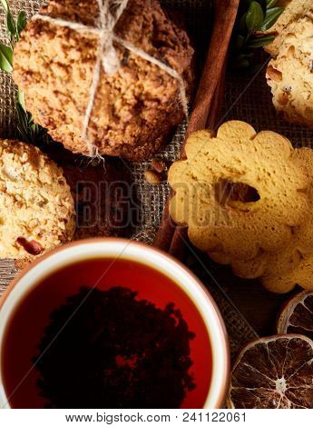 Cookies With Cinnamon And Tea On A Burlap Napkin, Selective Focus, Close-up, Top View, Vertical. Del