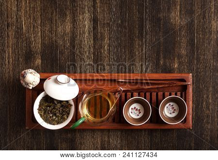 Cropped Shot Of Woman Holding Chawan With Green Oolong.