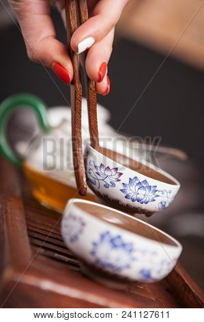 Cropped Shot Of Woman Holding Chawan With Green Oolong.
