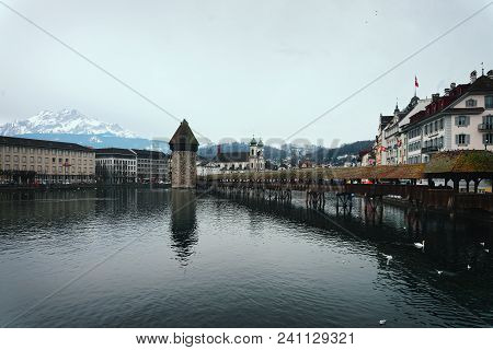 Lucerne, Switzerland - January 04, 2015: Famous Wooden Chapel Bridge At Lucerne In Switzerland. Subs