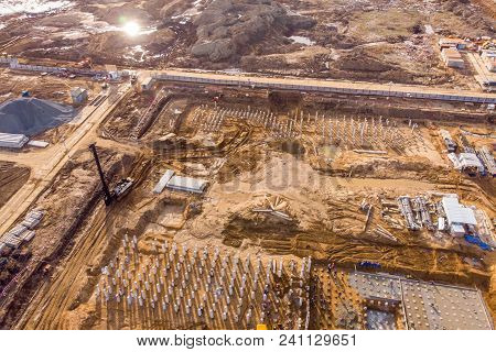 Foundation Ditch With Construction Machinery At Construction Site, High Angle View