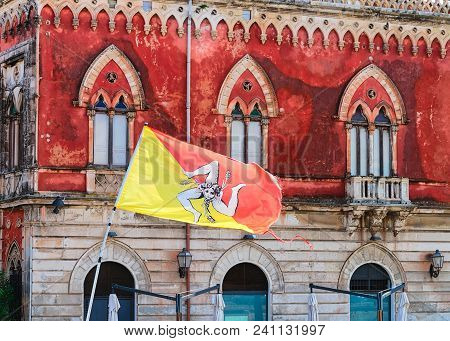 Sicilian Falg At An Ancient Building In Siracusa, Sicily, Italy